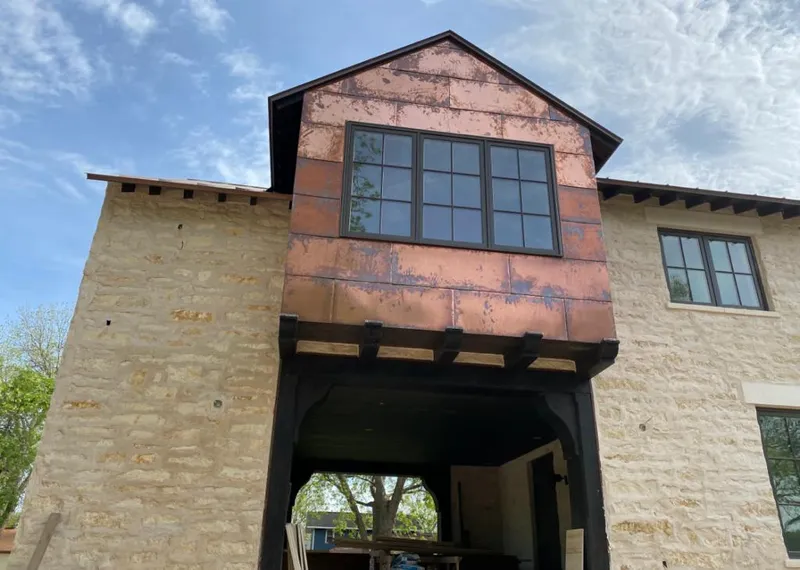 Copper metal panel facade on a stone building for Skylight Installation in Germantown